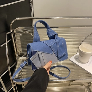 Fashionable denim patchwork crossbody bag with knot handle and adjustable strap