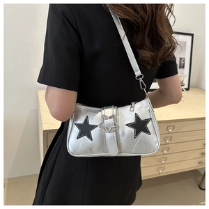Detailed back view of a silver Y2K shoulder bag featuring black star patches on smooth PU