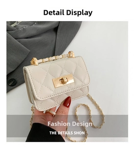 Detail showing white quilted crossbody bag with golden chain strap and turn-lock closure