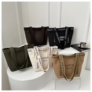 Minimalist canvas tote bags with FASHION BAG letters in five earthy neutral colors