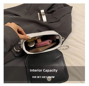 Internal capacity of white quilted crossbody bag showing phone, wallet and cosmetics