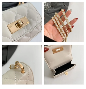 Detail view of mini quilted crossbody bag with gold lock and chain strap