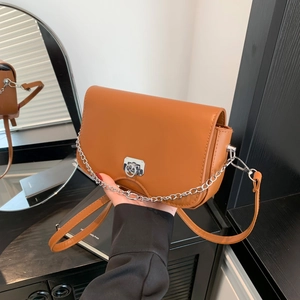 Brown minimalist crossbody bag with silver buckle and chain, summer 2024 fashion