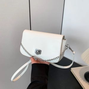 Minimalist white crossbody bag with silver chain and unique wavy bottom design