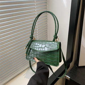 Green faux leather shoulder bag with crocodile pattern and stylish round handle for women