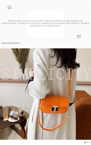Details der leuchtend orangefarbenen Stepptasche mit goldenem Verschluss im Café-Stil
