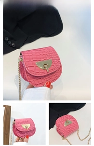Detailed views of pink crocodile pattern mini bag with gold chain and metal clasp
