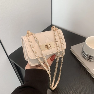 Chic quilted beige crossbody bag with gold-tone chain strap and classic turn-lock closure