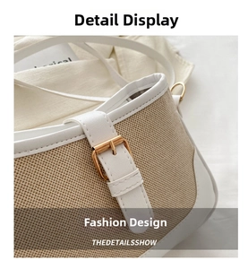 Detail of woven fabric texture with white leather trim and gold metal buckle on a crossbody bag