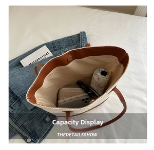 Detail shot of the large woven tote bag interior showing capacity for daily essentials