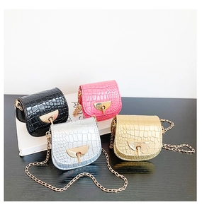 Group shot of four mini crocodile pattern saddle bags in pink, silver, gold and black