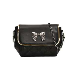 Quilted black chain crossbody bag with metallic bow and gold-trimmed flap cover