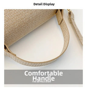 Detailed close-up of champagne gold woven fabric and flat handle on a luxury handbag