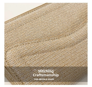 Detailed close-up showing precision stitching and woven texture of the golden evening bag