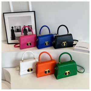 Six crocodile pattern handbags in vibrant colors with woven handles and golden T-shaped locks