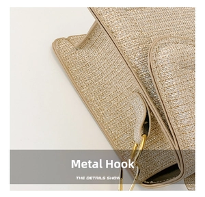 Detailed close-up of the premium golden hardware hook and textured woven fabric of the bag