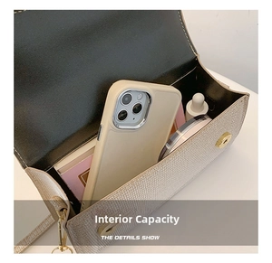 Detail shot of internal capacity showing storage for phone and makeup accessories
