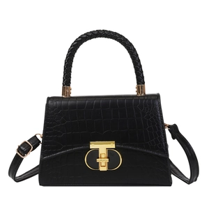 Elegant black crocodile pattern handbag with woven handle and gold T-shaped lock detail