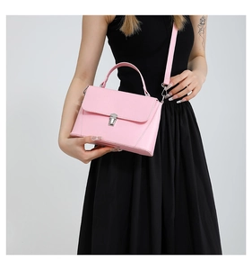 Pink retro crossbody bag detail showing silver metal clasp and smooth PU leather texture