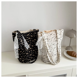 Floral print canvas tote bag with lace bow detail and large capacity for daily use