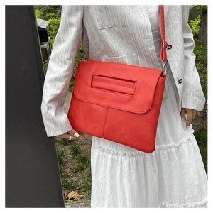 Modern red PU leather envelope crossbody bag with adjustable strap and gold buckle