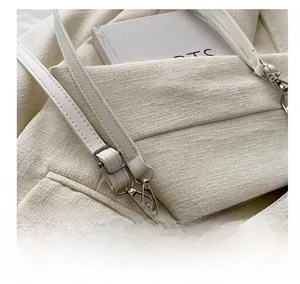Detail of adjustable leather strap with silver buckle and rhinestone embellishments