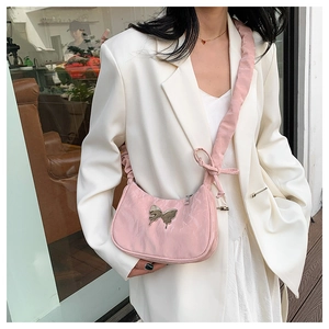 Pink shoulder bag with silver butterfly charm and pleated padded strap detail