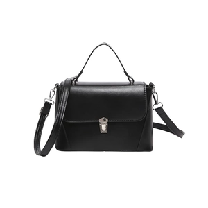 Chic black PU leather crossbody bag with silver lock and adjustable shoulder strap