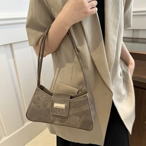 Minimalist dark brown baguette shoulder bag in matte faux leather with vintage metal clasp