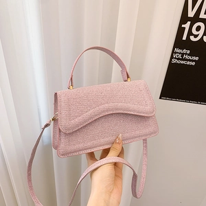 Chic pink woven shoulder bag for women with top handle and slender crossbody strap