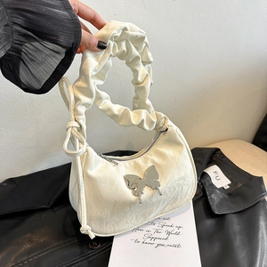Cream pleated shoulder bag with silver butterfly metal ornament and cloud texture strap