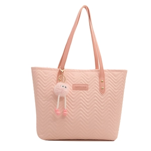 Pink quilted tote bag for women with V-pattern texture and plush monster charm pendant