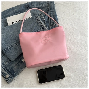 Pink nylon shoulder bag with onwards and upwards embroidery on textured background