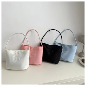 Set of four minimalist satin shoulder bags in white, pink, black, and blue colors