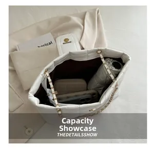 Detailed interior of quilted white chain tote showing spacious storage for daily essentials