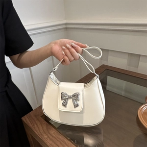 Minimalist cream white bow shoulder bag with silver metal buckle and chic chain strap