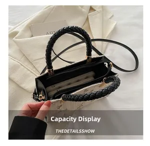Interior view of straw woven handbag showing the zipper pocket and large capacity