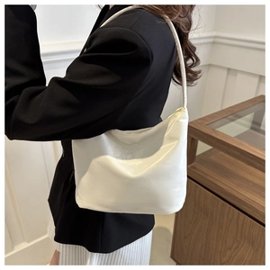 Minimalist white shoulder bag with 'Onwards and upwards' embroidery for women