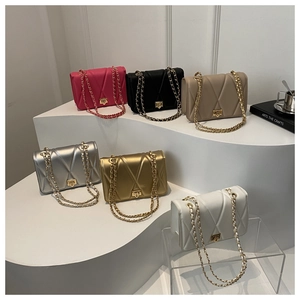 Chic quilted chain bags in six colors displayed on stairs with modern accessories