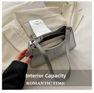 Detailed interior view of a silver metallic hobo bag showing spacious daily capacity