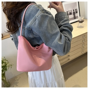 Pink minimalist leather shoulder bucket bag with onwards and upwards embossed text