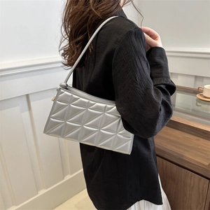 Silver quilted crossbody phone bag with metallic finish and geometric stitching pattern
