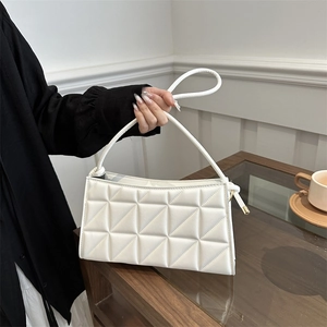 White quilted faux leather crossbody bag with top handle and elegant stitching details