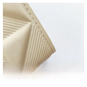 Macro shot of high-quality off-white faux leather with horizontal embossed stripe details