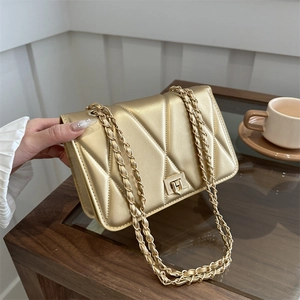 Quilted chain shoulder bag in metallic gold finish with elegant square metal lock