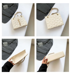 Detailed view of cream quilted chain shoulder bag with gold geometric stitching texture