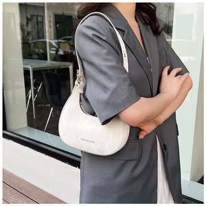 Detail of white marble-patterned crescent shoulder bag with FASHION & BAGS print