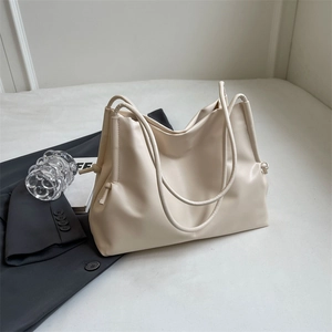 Minimalist off-white large capacity tote bag with soft leather texture for daily commute