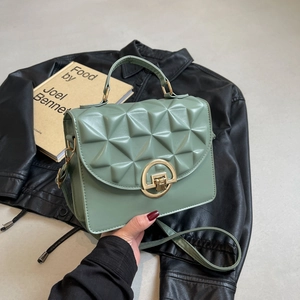 Chic bean green quilted crossbody bag with gold ring lock and structured handle