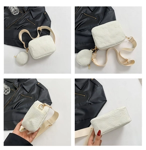Detail view of white crossbody bag with heart relief texture and round mini coin purse